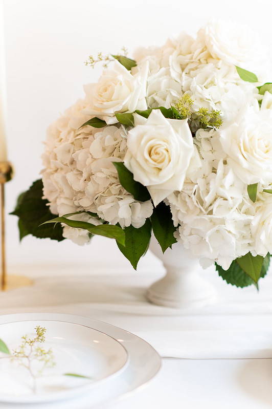 hydrangea and rose centerpiece white vase