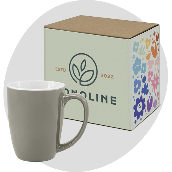 Olive ceramic mug displayed beside a branded gift box with colourful floral pattern