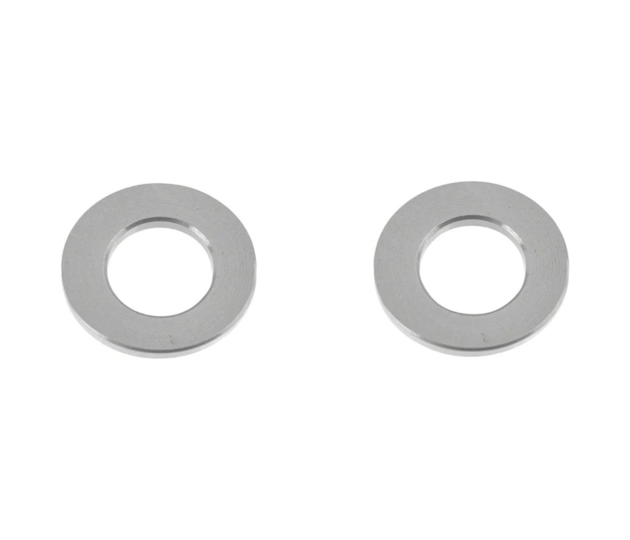 Two metallic washers lying flat on a white background.