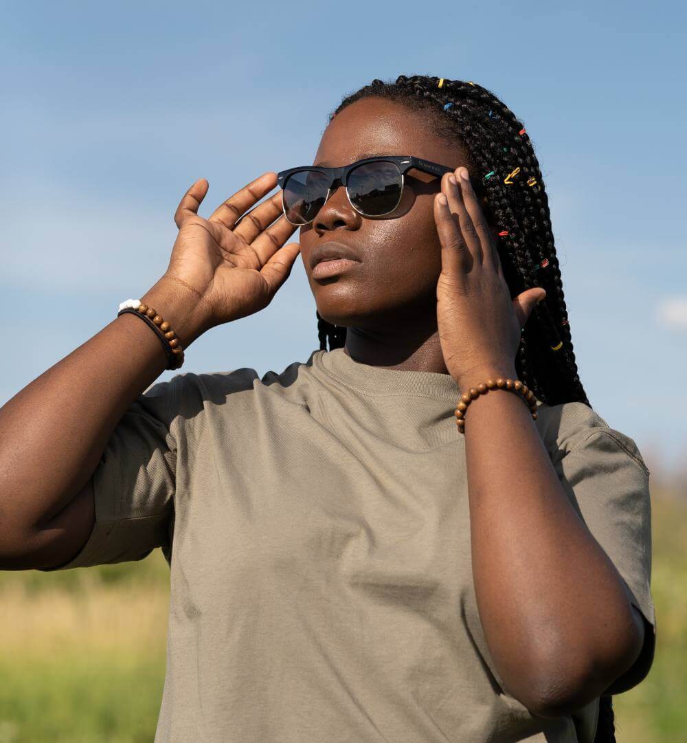 Woman wearing Black Jaguar, Clubmaster Oversized Sunglasses Featuring Ebony Wood Arms