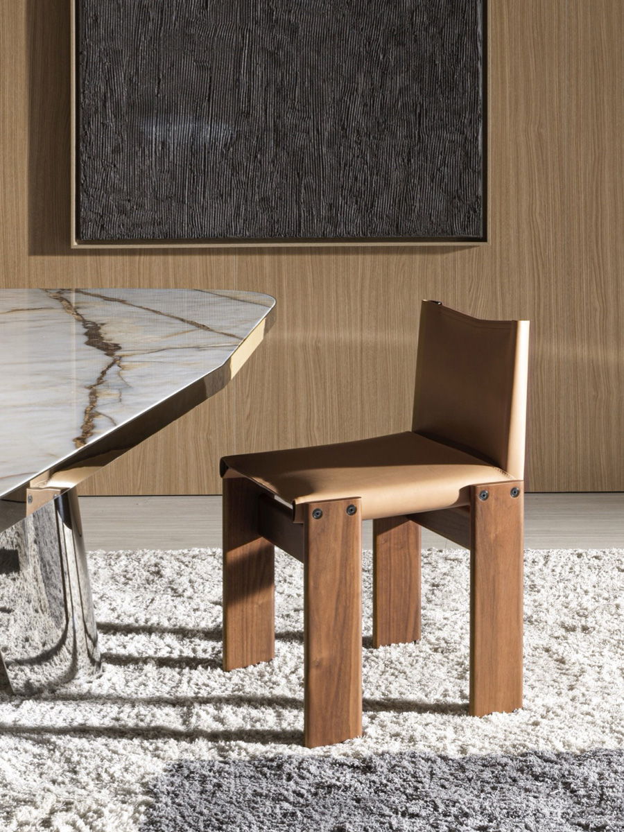 A wooden Molteni chair beside a modern table in a stylish room.