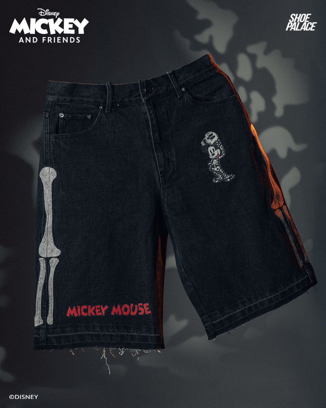 Black shorts featuring Mickey Mouse and skeleton graphics.