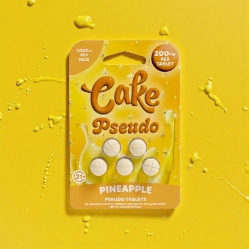 Pineapple-flavored tablet packaging on a bright yellow background.