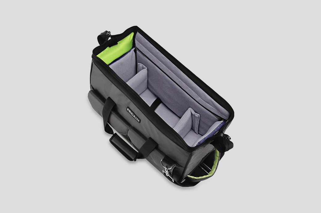 Black bag with gray interior and adjustable dividers, viewed from above.