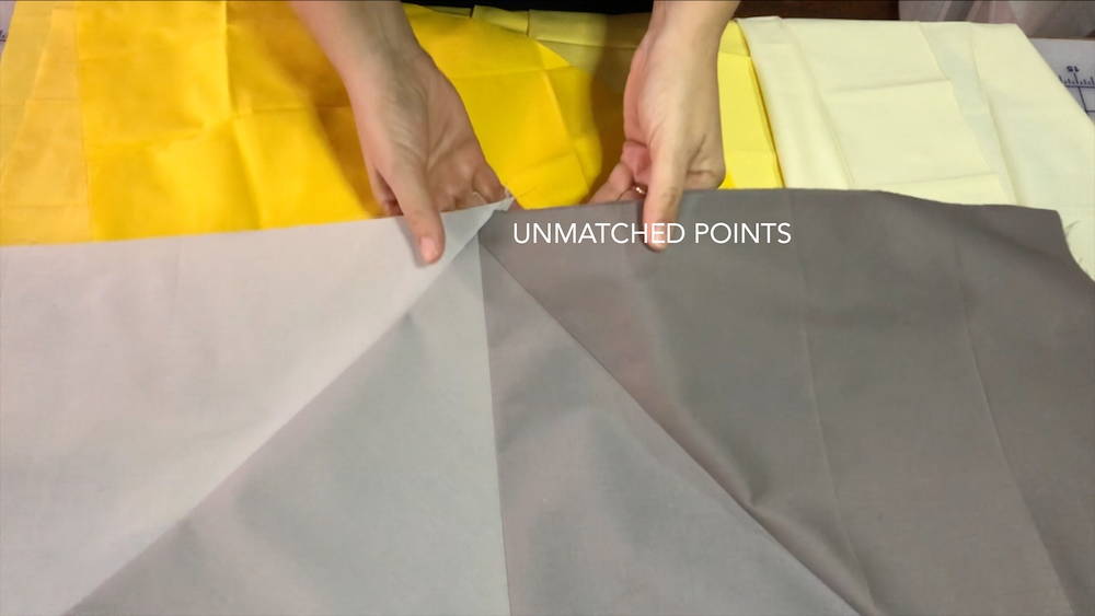 unmatched points of triangles on a baby quilt top
