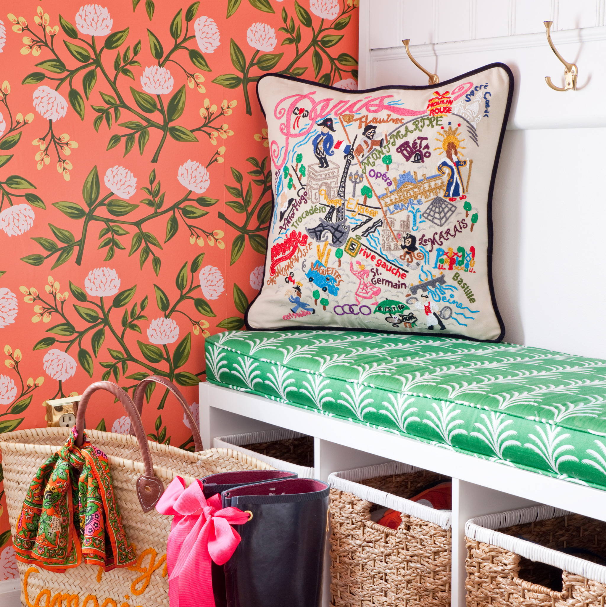 Paris hand-embroidered cushion on a green entry way bench with floral wallpaper