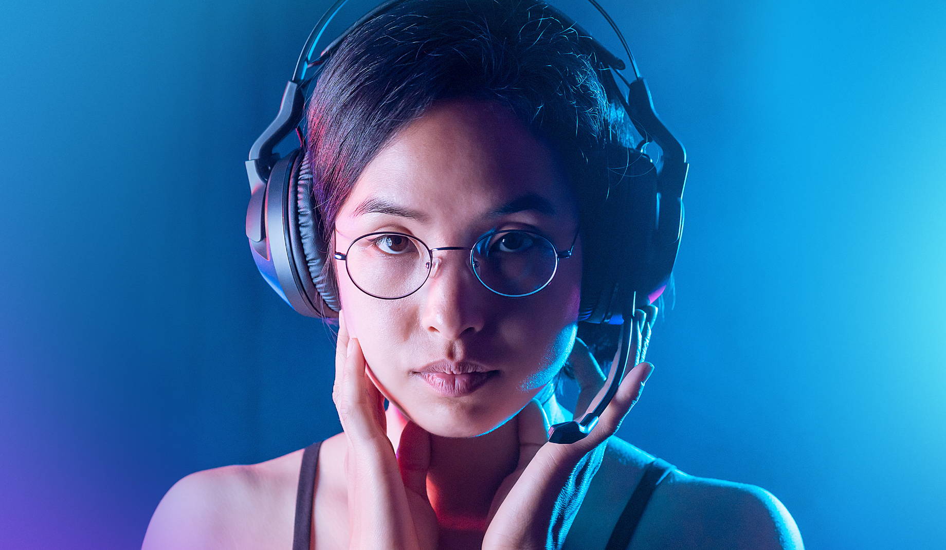 Girl with glasses wearing an Elo Wireless Headset