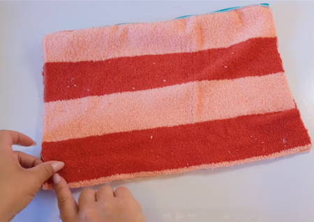 Both panels right sides together, sewing the bottom seam