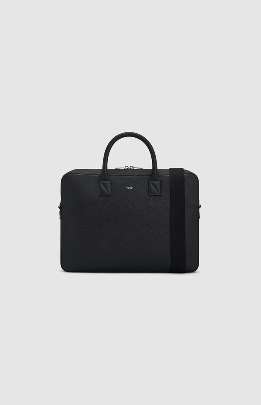 Black briefcase with handles and a shoulder strap on a light background.