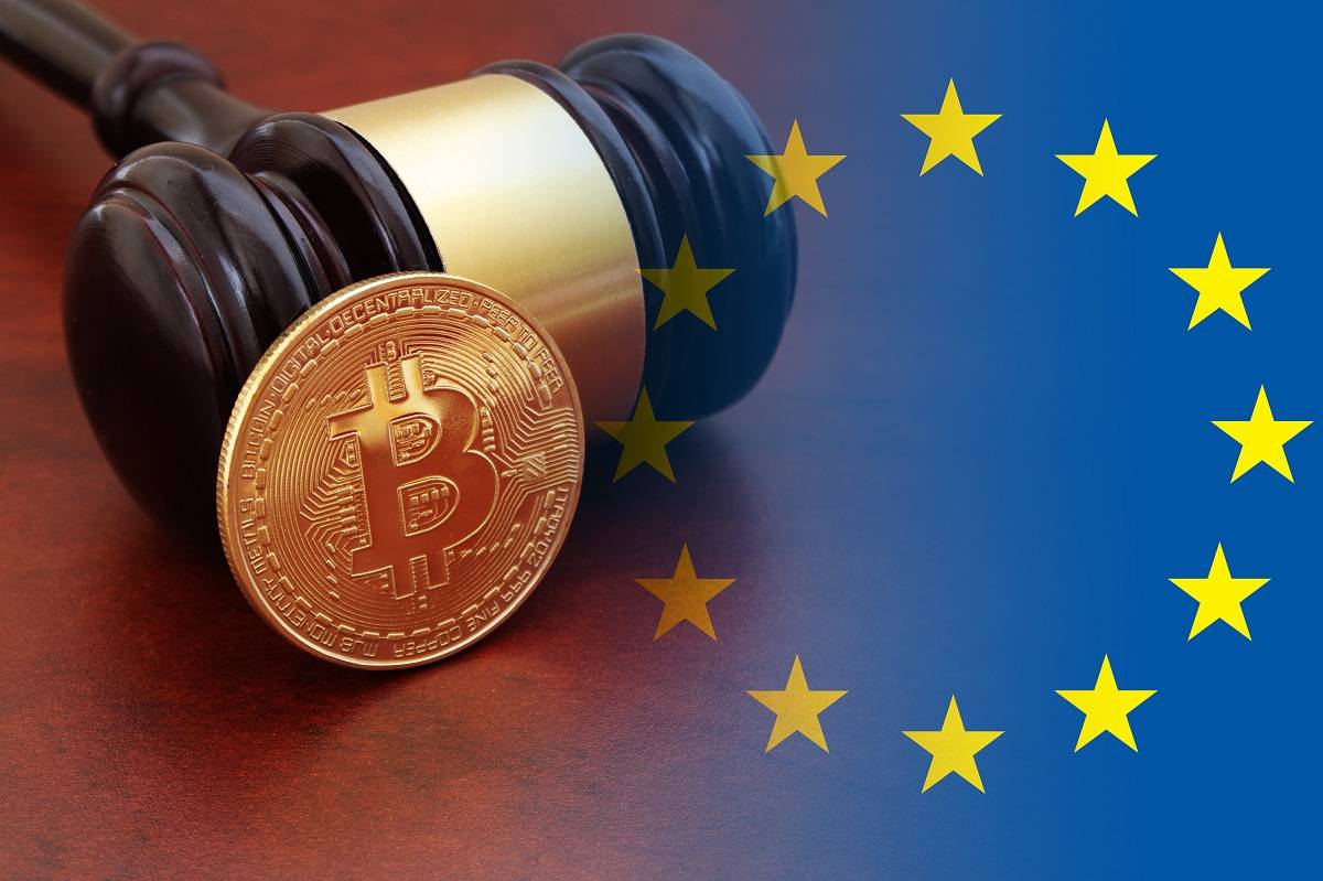 EU flag and bitcoin leaning on a gavel