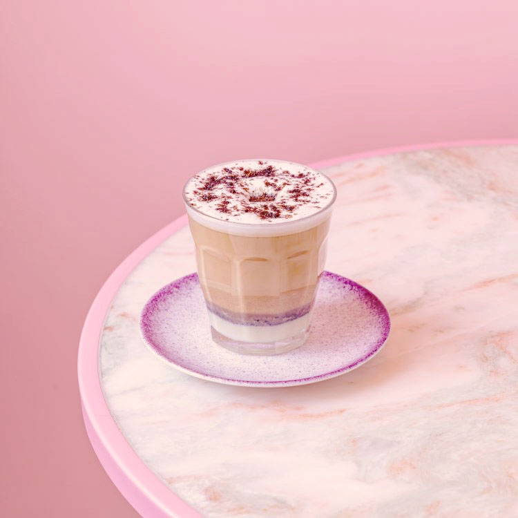 Pistachio Iced Spanish Latte served on pink tray