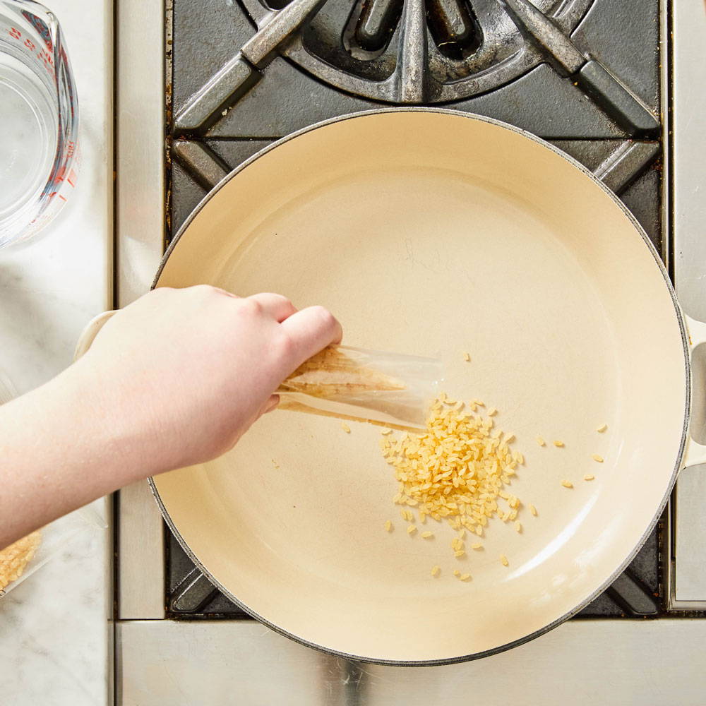 How to make risotto: add rice to sauce pan