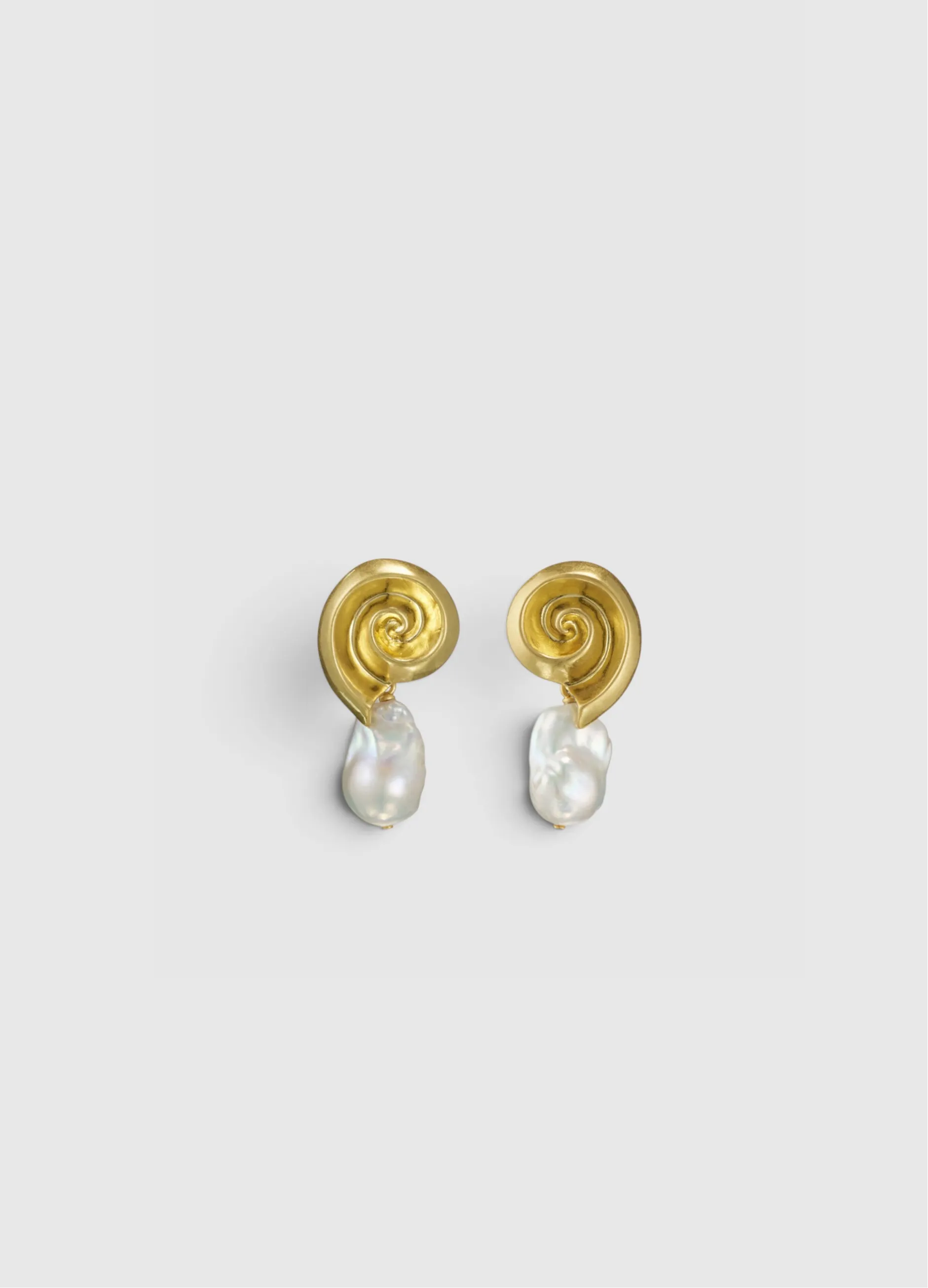 Gold swirl earrings with pearl drop.