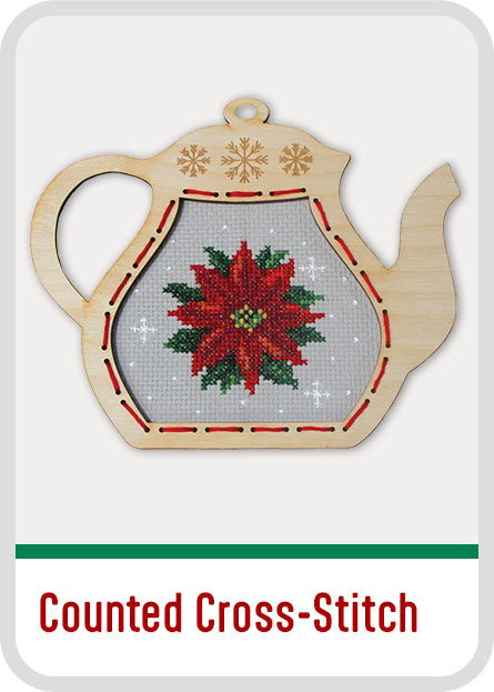 Wooden teapot with counted cross-stitch poinsettia design. Christmas Counted Cross-Stitch kits