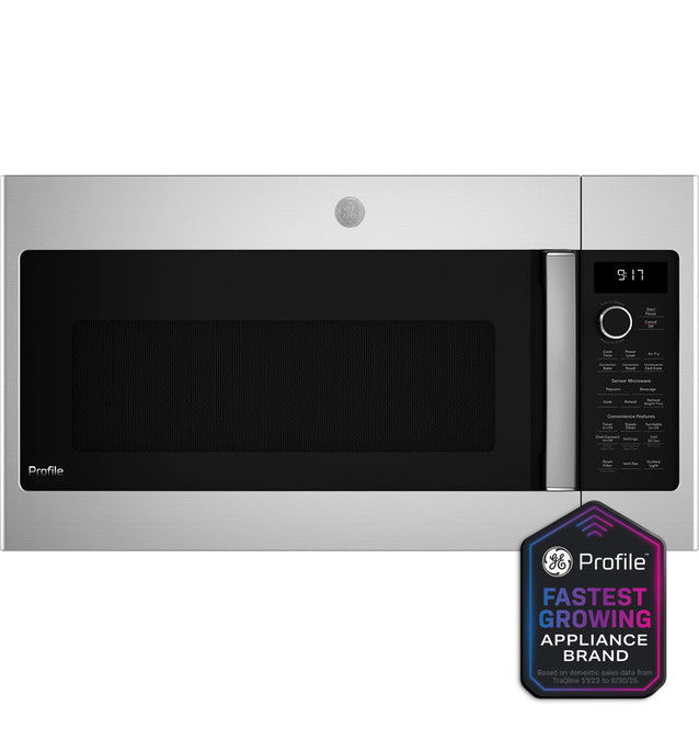 Stainless steel microwave with control panel and brand logo.