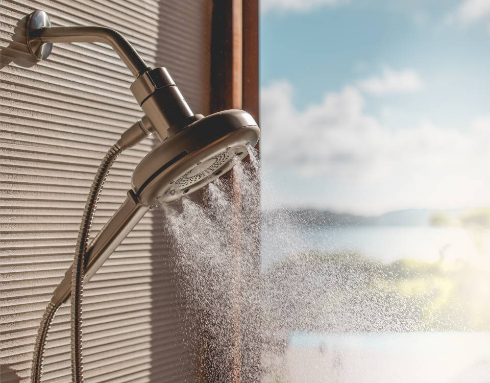 Image of Corre Showerhead turned on spraying into the shower.