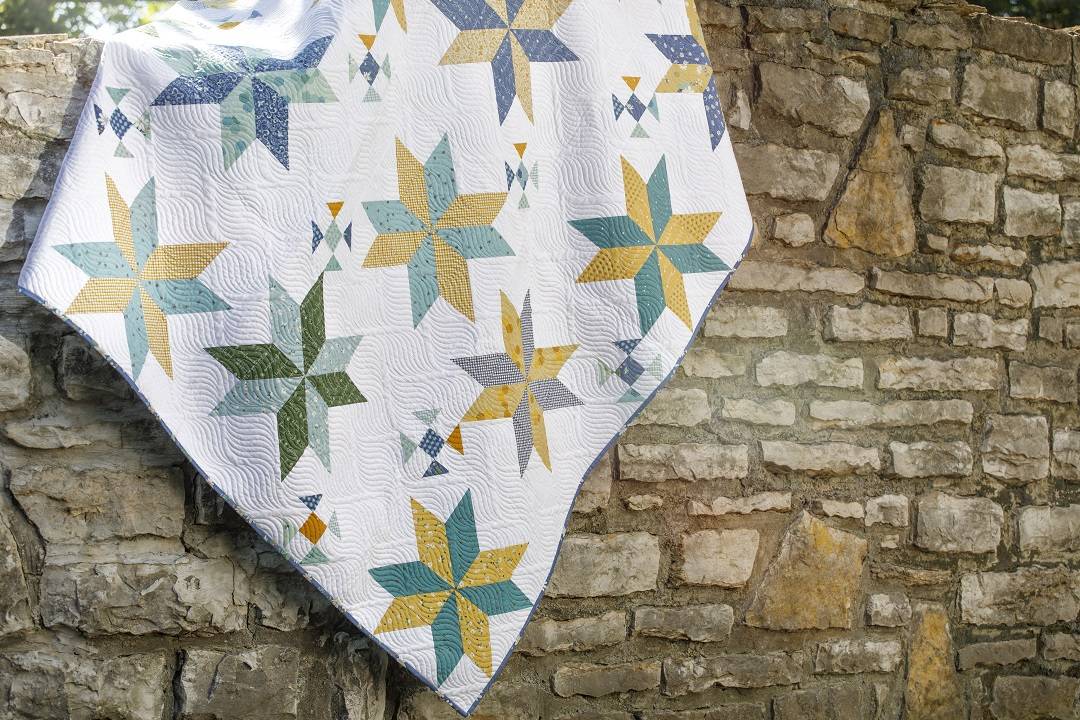 Scattered Shoofly Stars Quilt using Layer Cakes