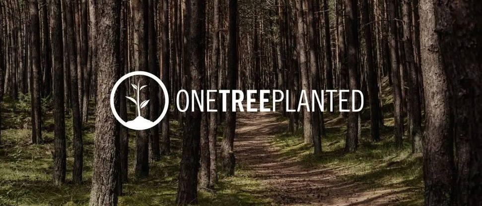 One Tree Planted Logo Over Image Of Grove of Trees