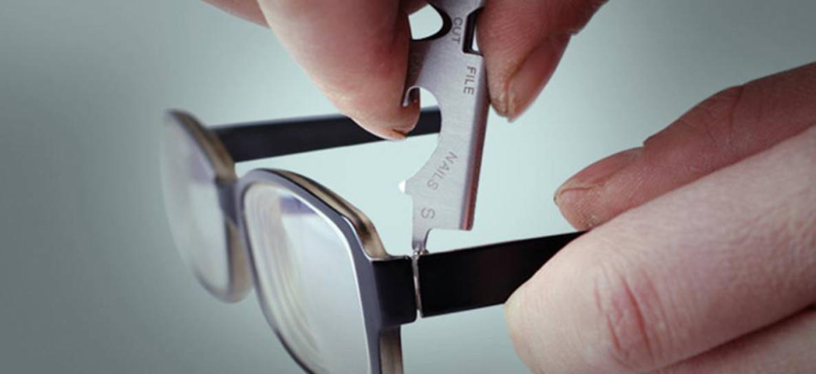8-in-1 Multipurpose Keychain Tool unscrewing an eyeglass screw
