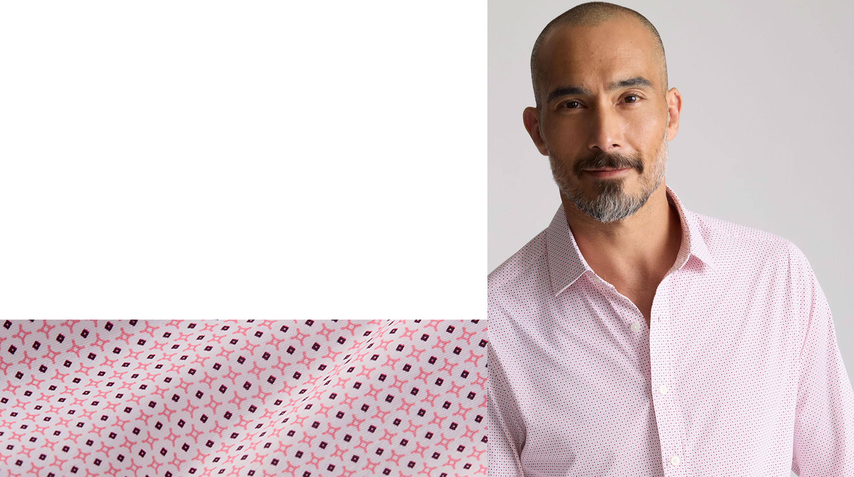 A man in a pink shirt with a patterned background.