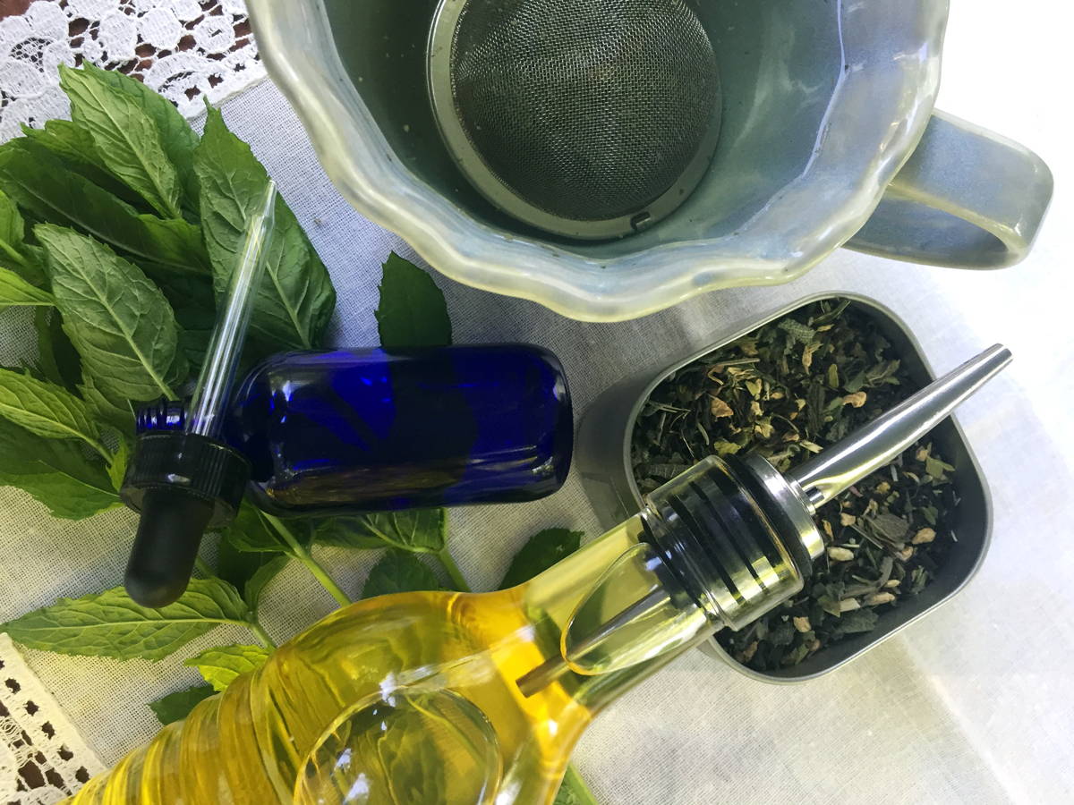 oils, dried herbs, bowls, sieves, tincture jars