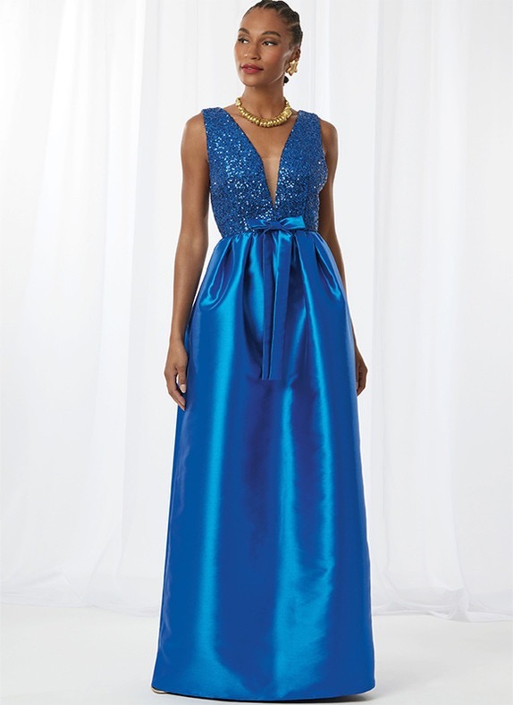 A woman in a blue evening gown with a deep neckline and pockets.