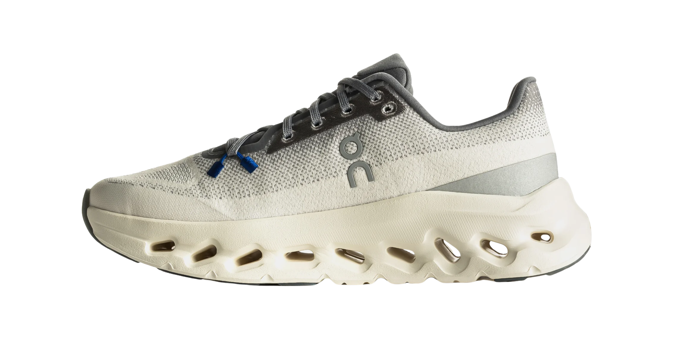 Gray athletic shoe with a unique sole design and blue accents.