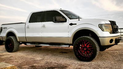 TIS544MBR Red Wheels on a White Ford