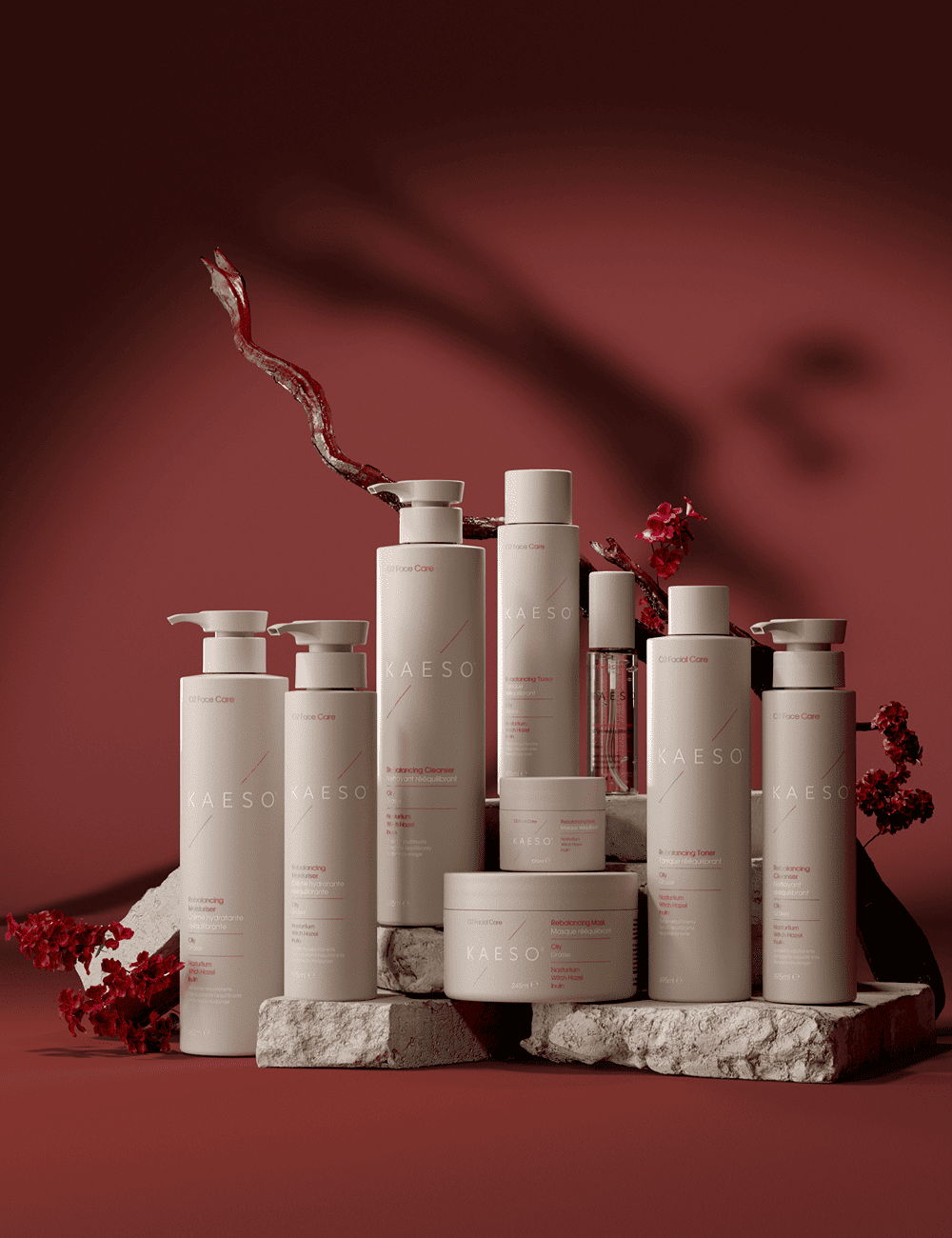 A collection of skincare products arranged on a red background with decorative elements.