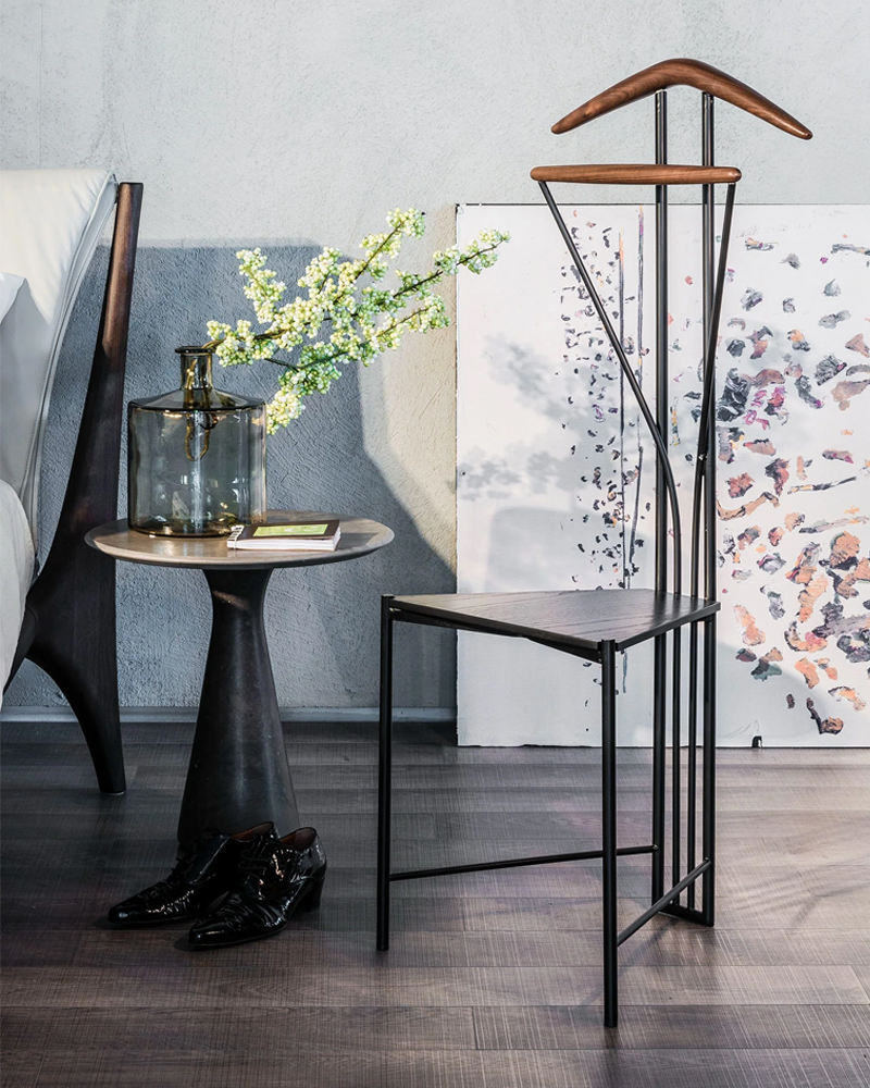 Stylish Yannik Valet Stand by Cattelan Italia, and decorative elements in modern interior setting.