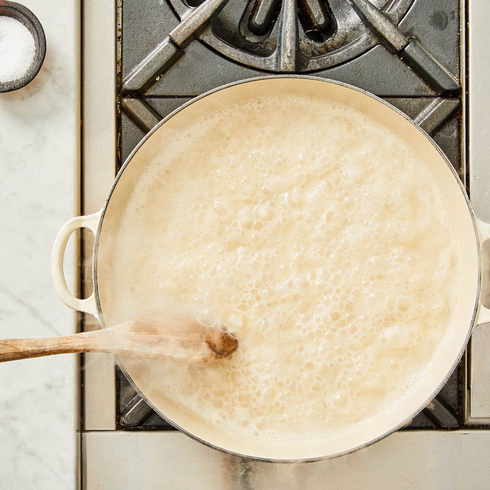 How to make risotto: stir rice and water in sauce pan