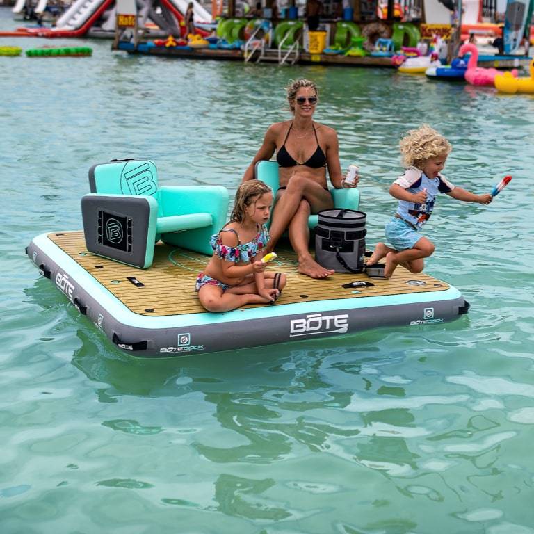 Woman sitting on an Aero Chair on her Dock 7 while her kids play