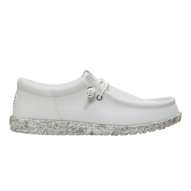 White shoe with a textured sole and lace detail.