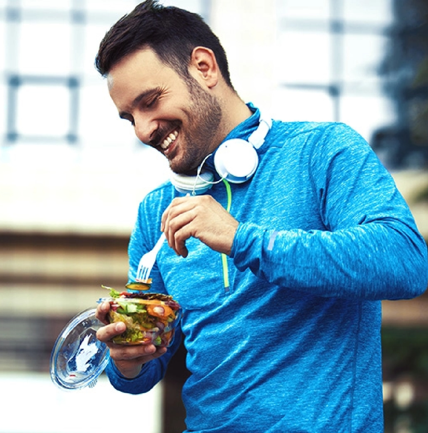 Person eating a salad looking happy and healthy from using Complement Creatine.