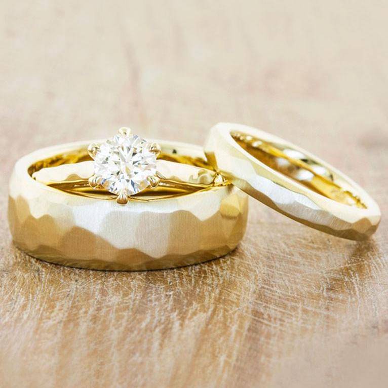 his and her matching faceted wedding bands in yellow gold