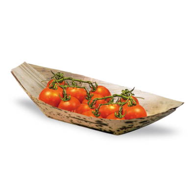 A bamboo leaf food boat containing tomatoes