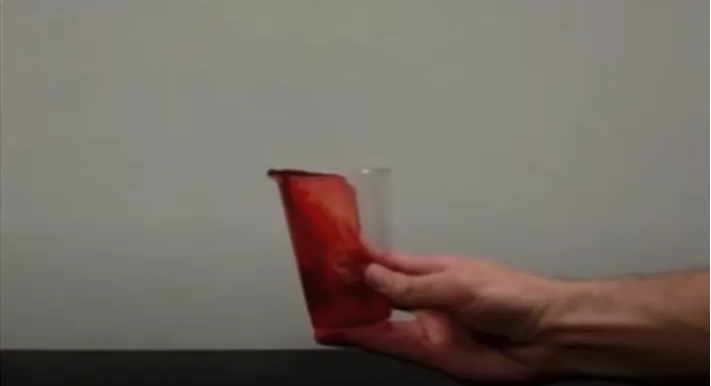 Liquid spilling in cup