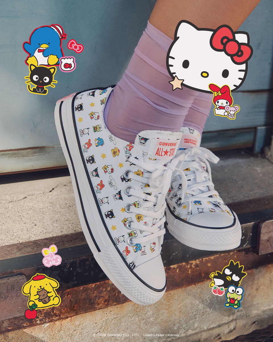 Colorful sneakers with cartoon character stickers and pastel socks.