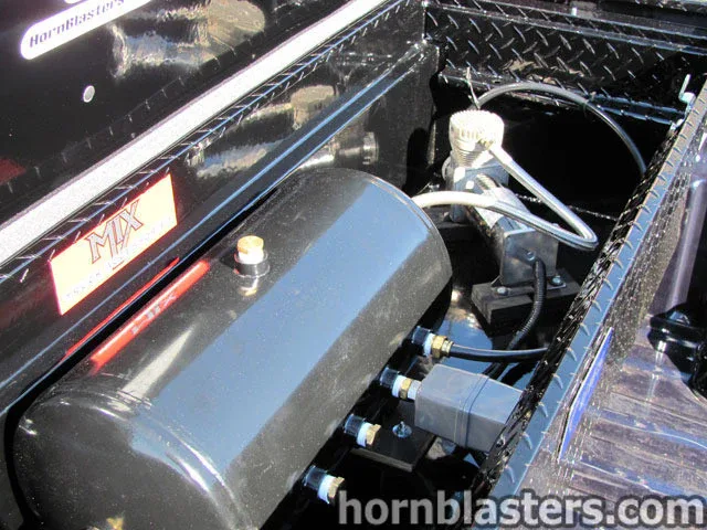 Rear three-quarter or bed view Chevrolet Silverado 1500 stance Shocker XL train horns context photo 4