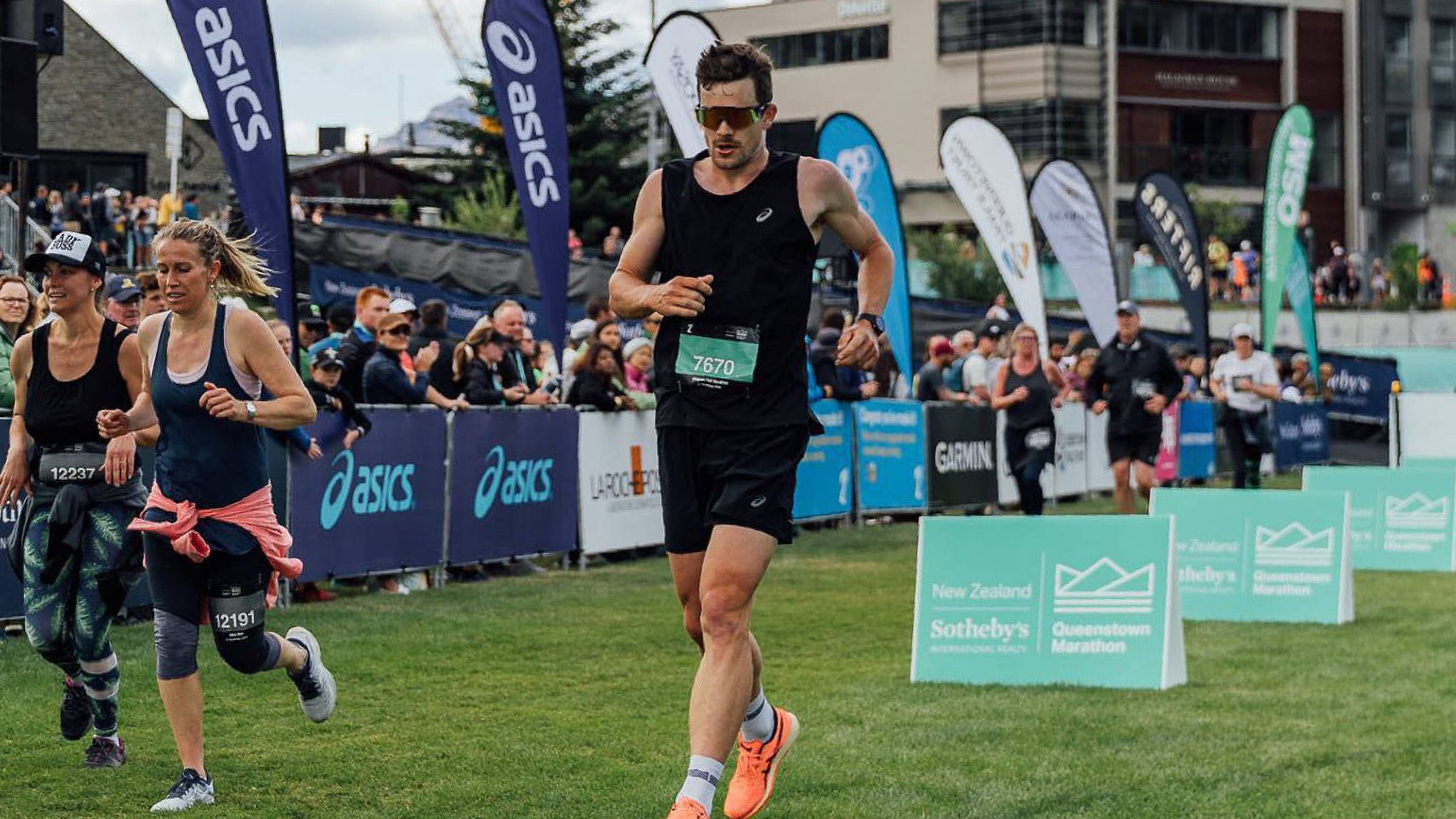 Mike Phillips crossing the finish line of the Queenstown Marathon
