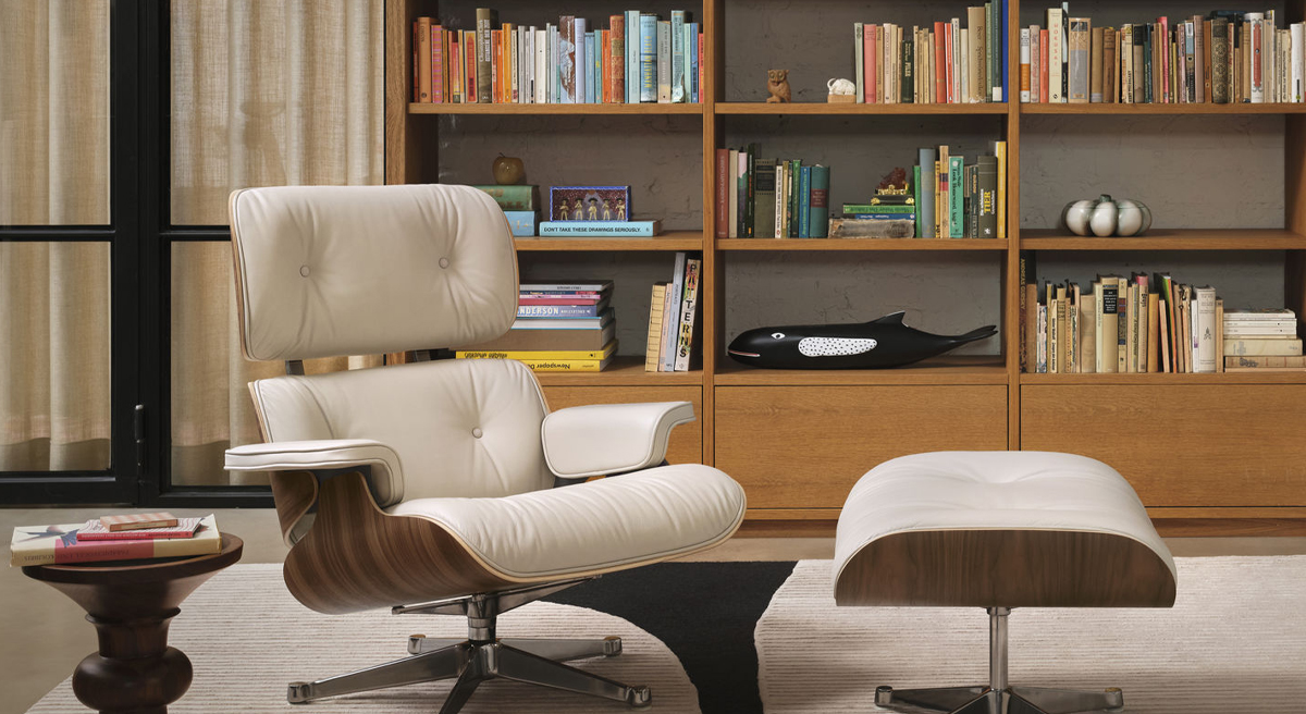 A brown leather chair and ottoman in a stylish living room setting.