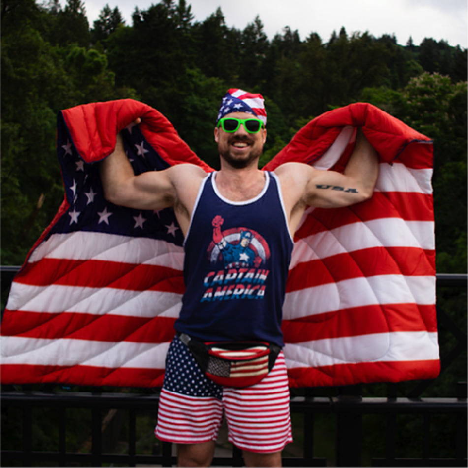 John Pinney wearing American flag Rumpl and Chubbies