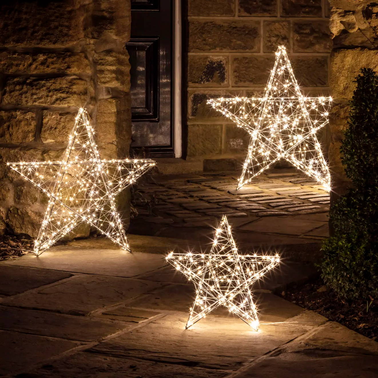 Star lights illuminated outside a cottage