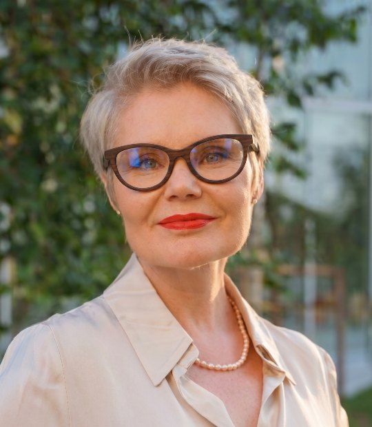 old woman wearing Charm Purple wooden cat eye glasses to look younger