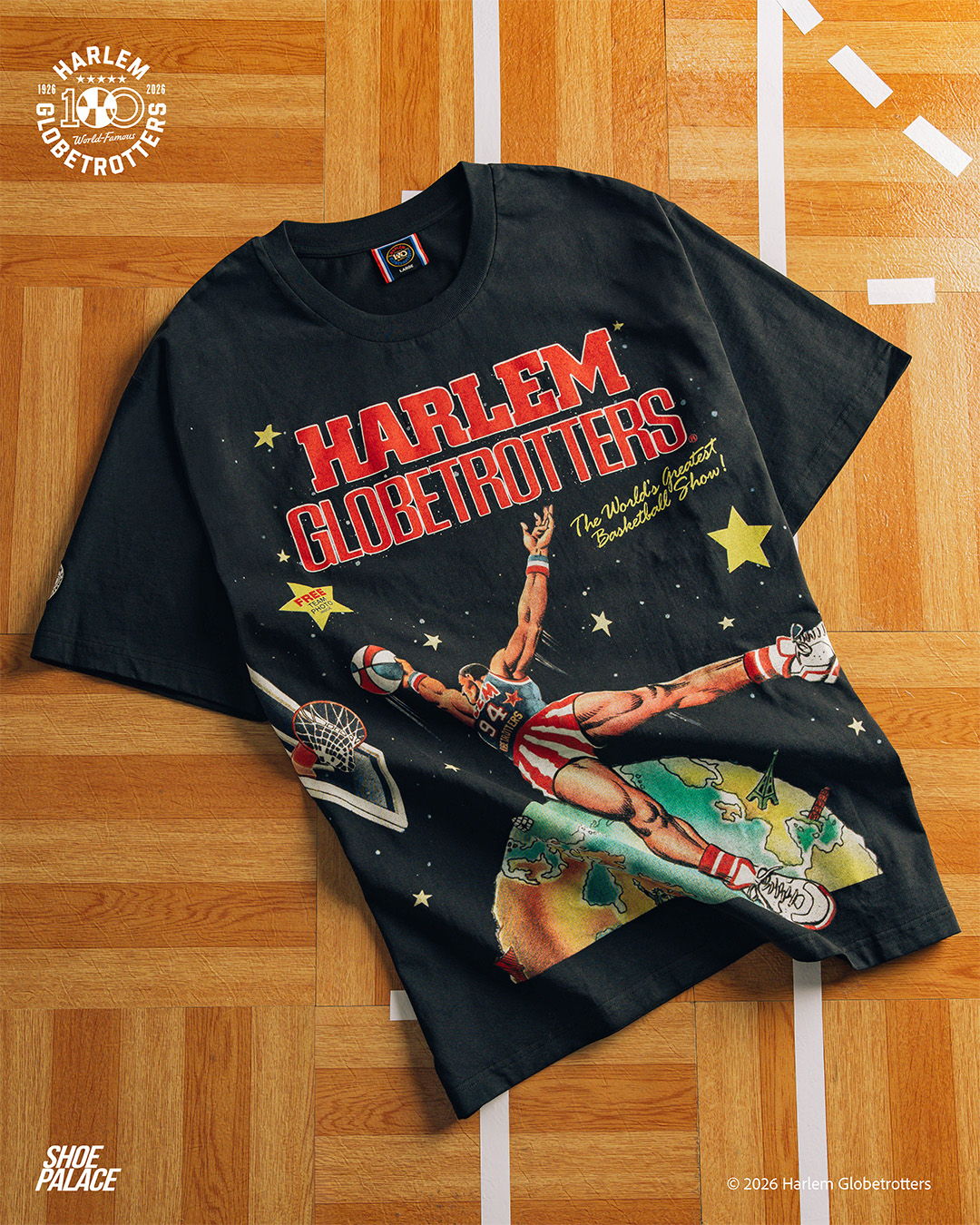 Black t-shirt featuring Harlem Globetrotters graphic and colorful design.