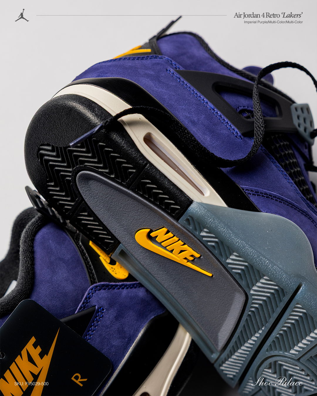 Close-up of Nike Air Jordan sneakers in purple and gray.