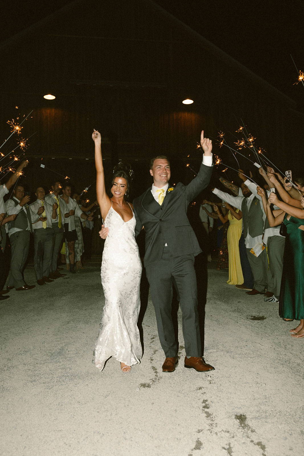 Bride and Groom with sparklers and bridal party