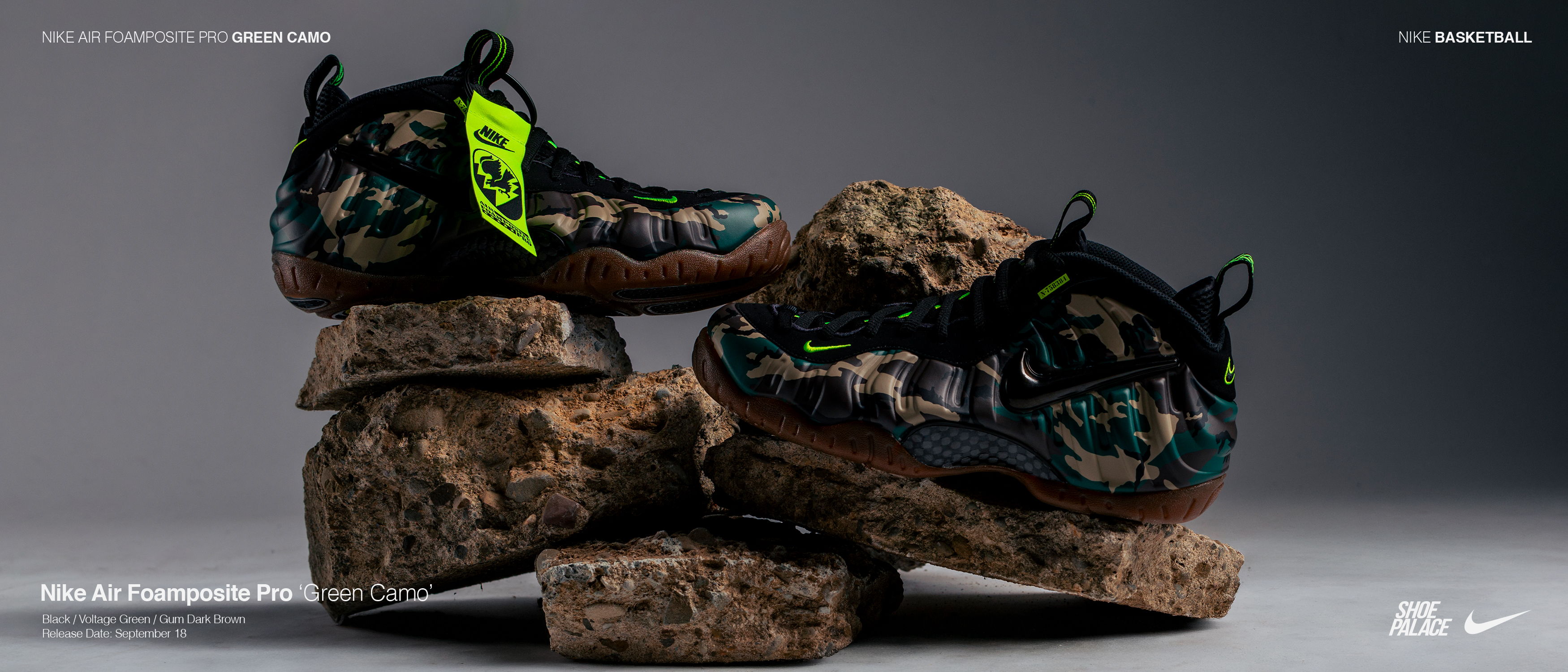 Stylish sneakers displayed on textured rocks against a gradient background.