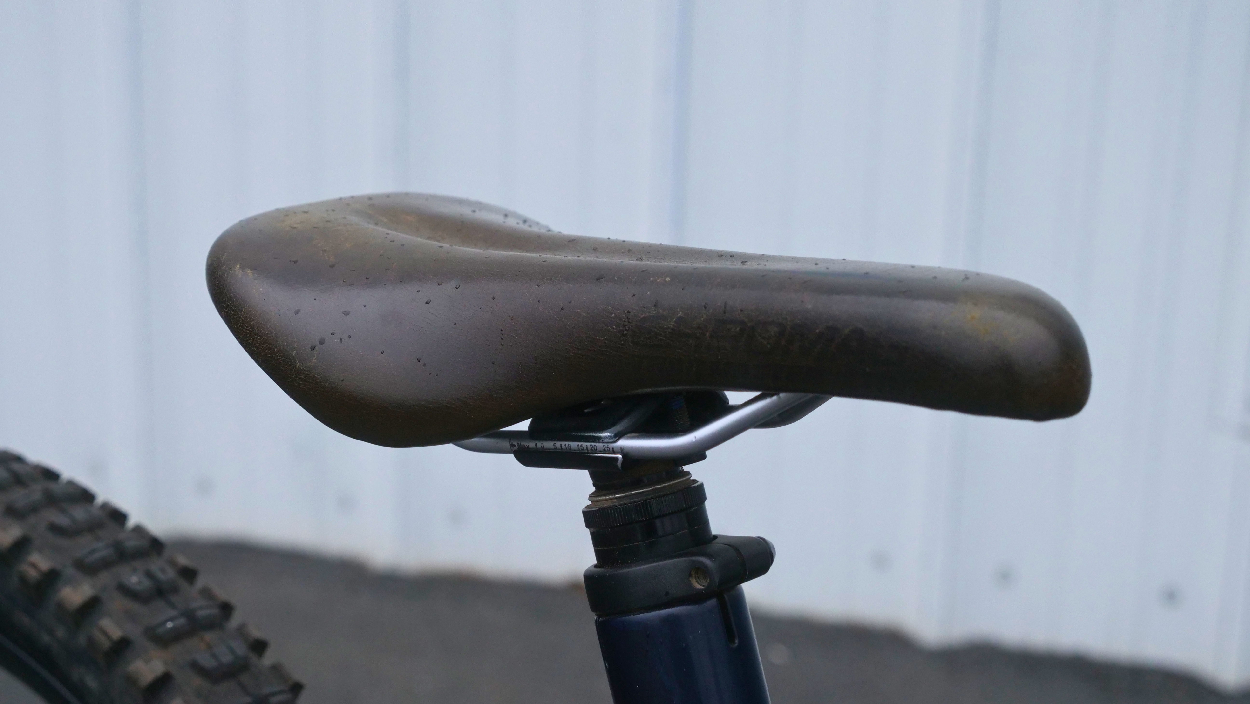 Close-up of a bicycle seat on a bike frame.
