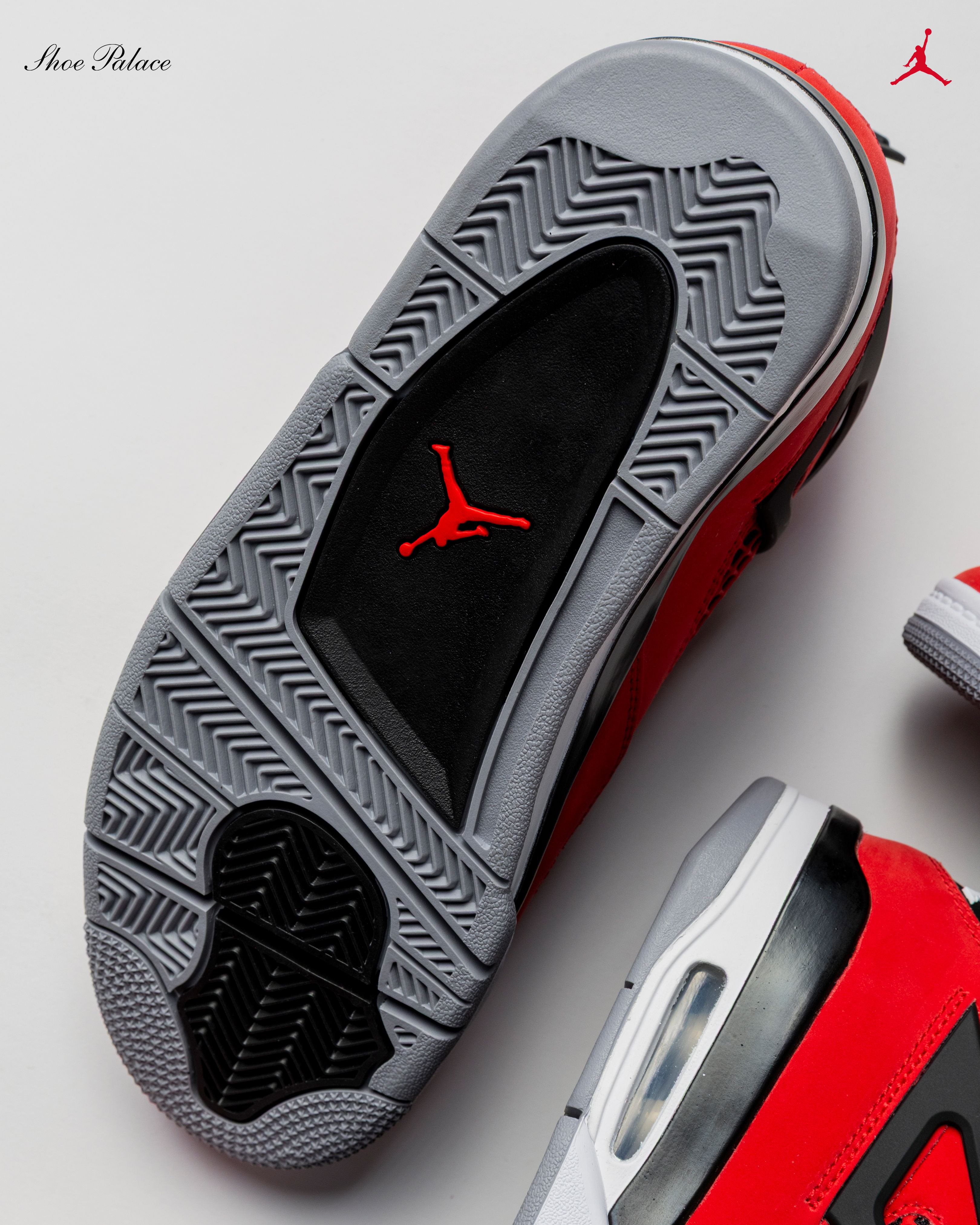 Red and gray sneaker sole with a Jumpman logo.